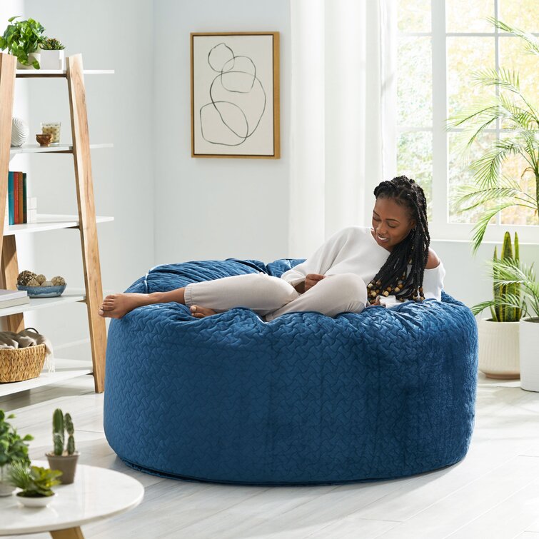 Blue velvet bean bag shop chair